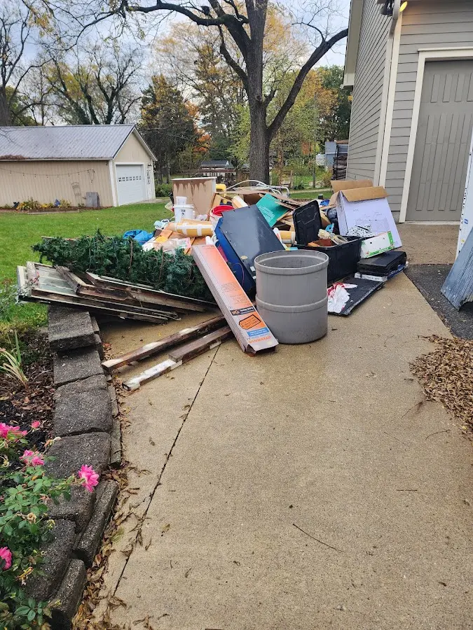 Dumpster being loaded with debris for 3 Yard Dumpster Rental in Tiburon
